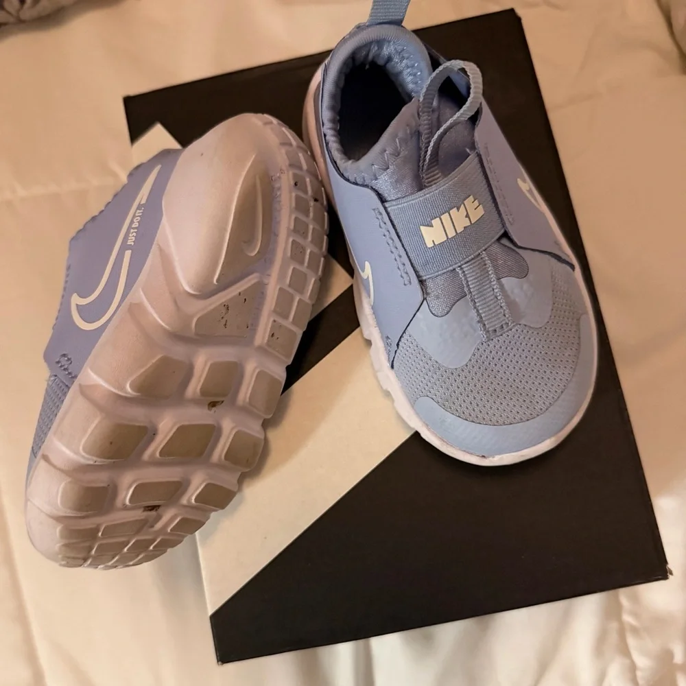 Nike Light Blue Slip-On Sneakers with White Swoosh